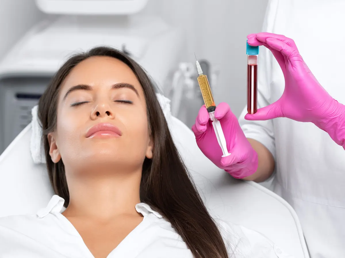 A woman receiving a PRP facial treatment