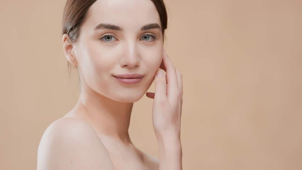 A woman smiling after getting a liquid facelift in San Antonio